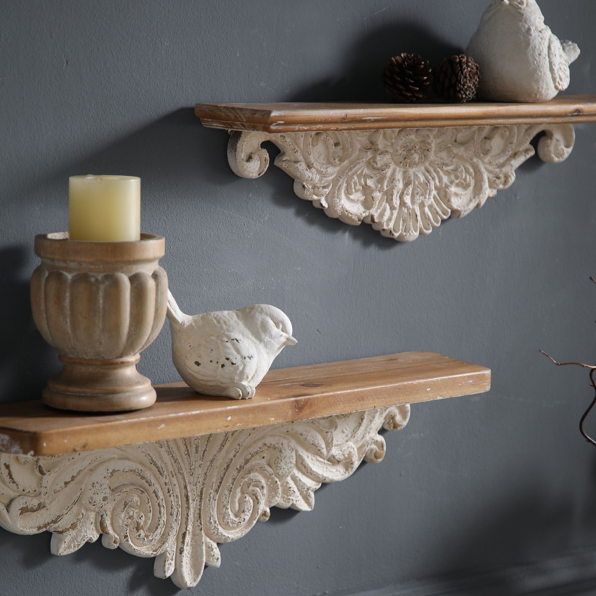 Close-up detail of Jennifer wall ledge shelf showing the carved floral apron with central rosette and scrolled side terminals