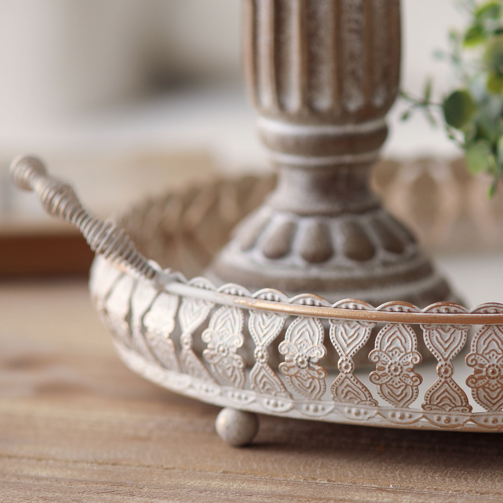 Close view of the embossed gallery rail and ball foot on the Jewel tray