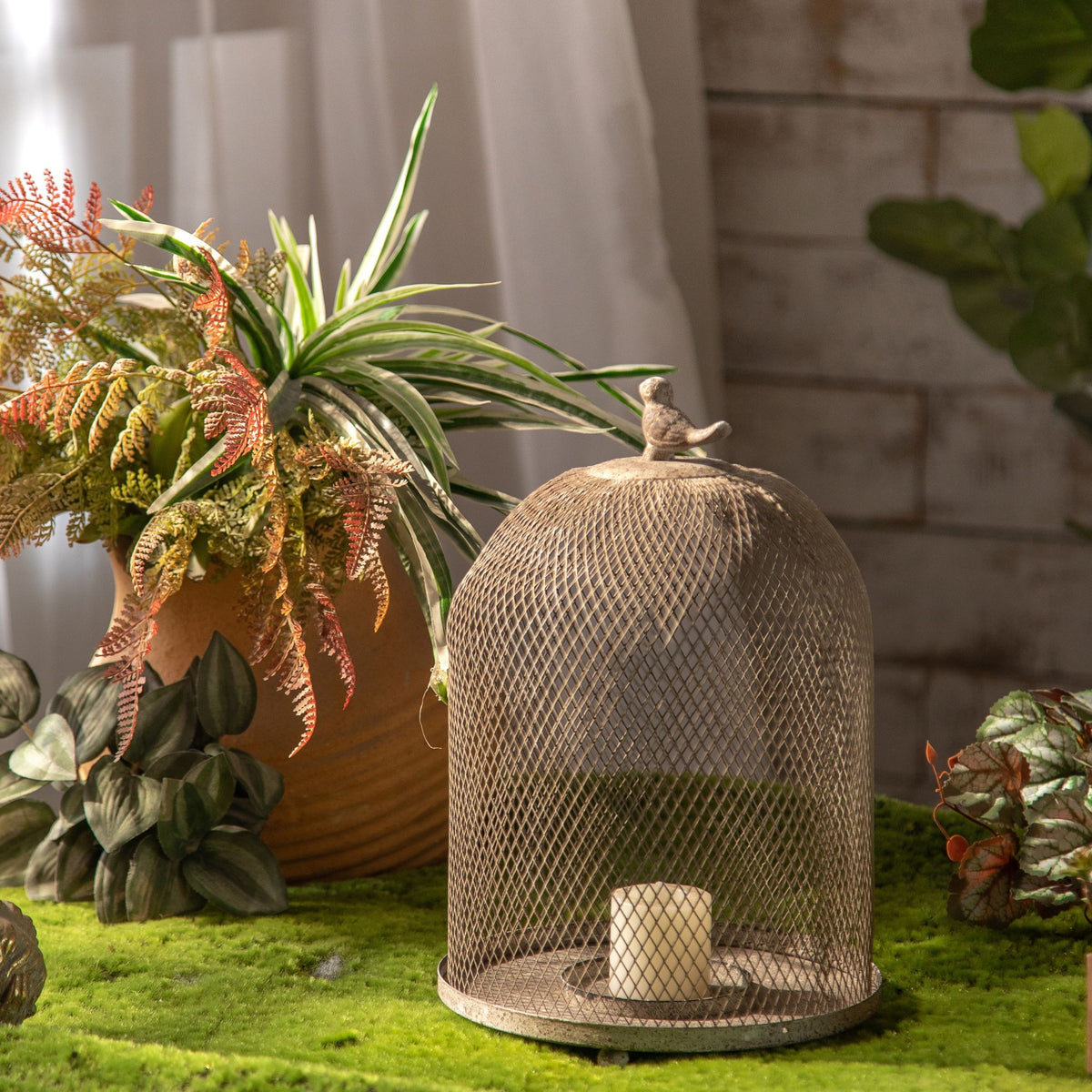 Joel candle cloche, daylight detail of the wire mesh dome and cast bird finial.