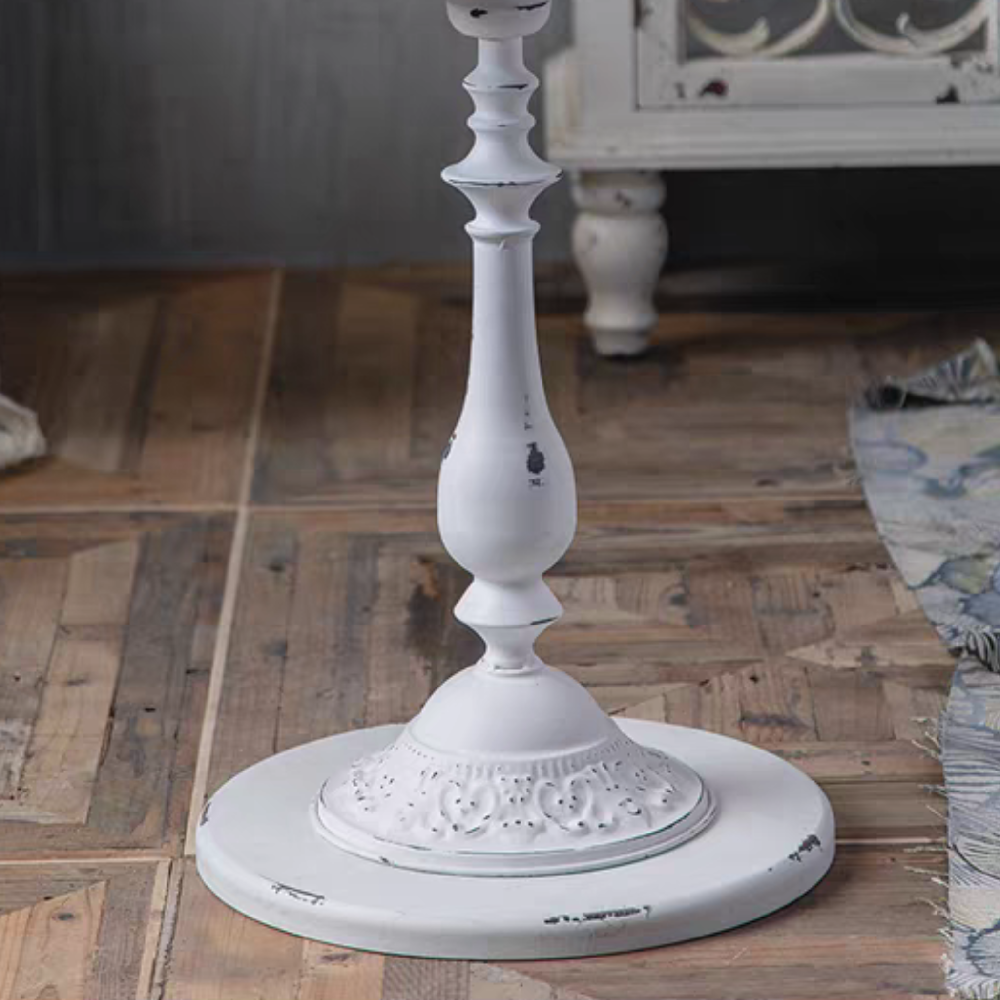 Juliette side table close-up of the distressed white pedestal foot with moulded relief