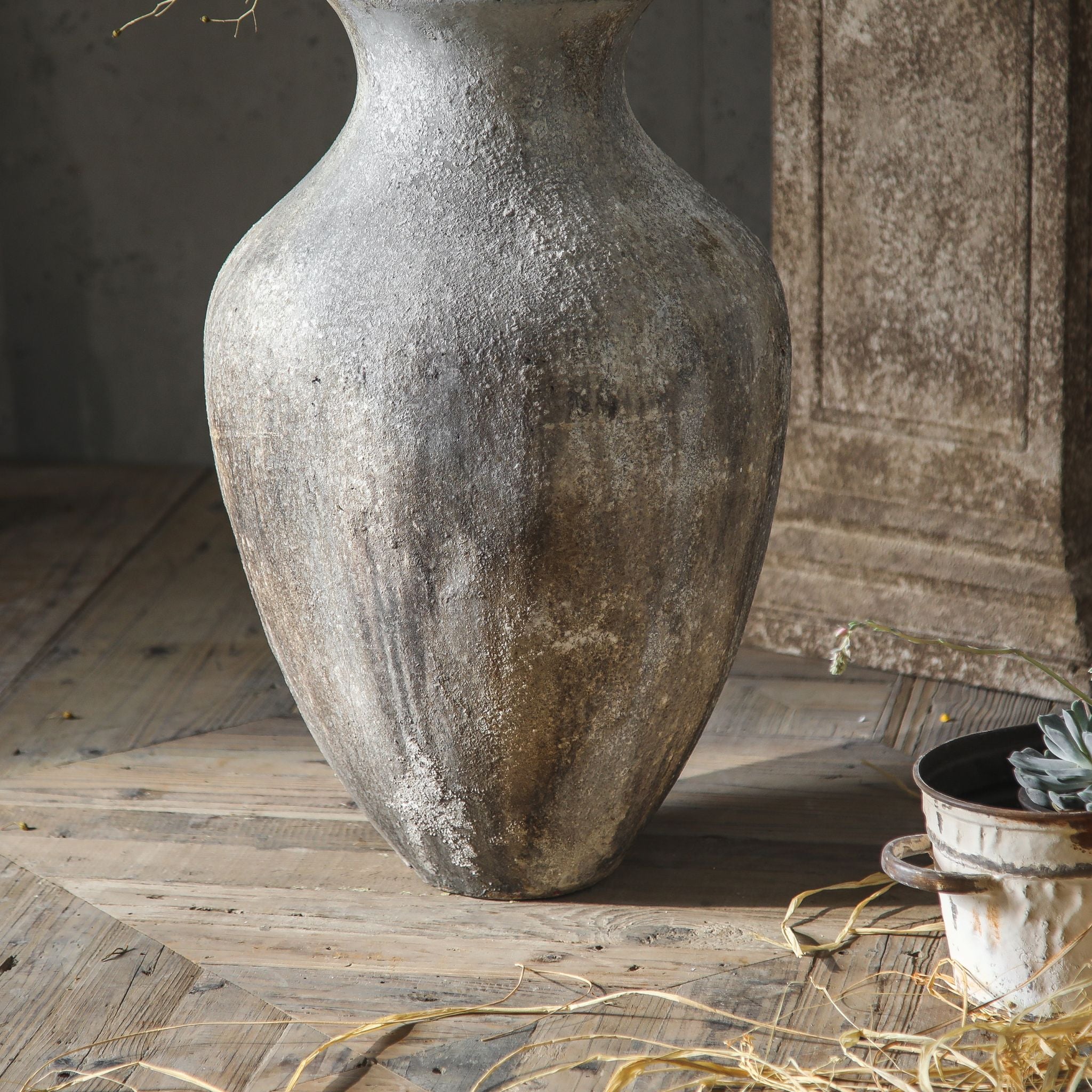 Lionel floor vase full urn silhouette on timber floorboards