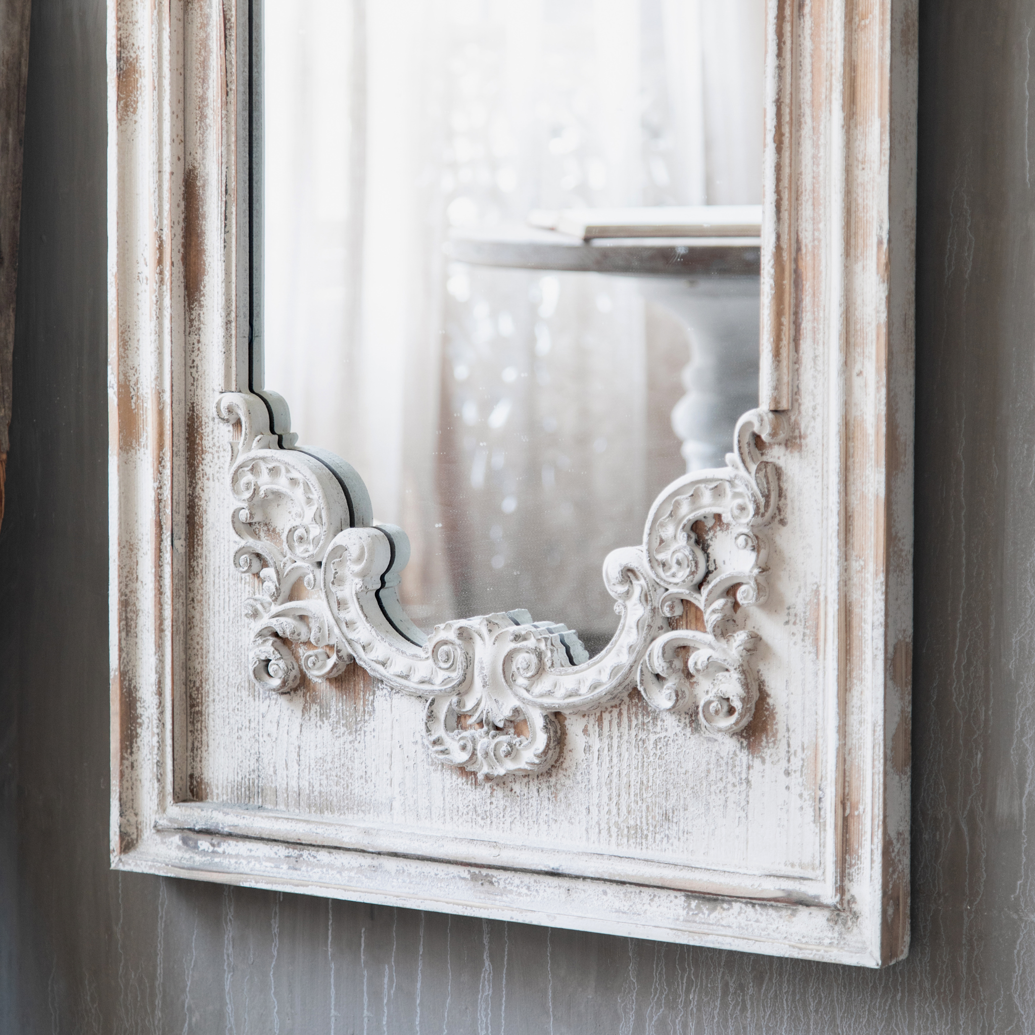 Bottom scrollwork ornament detail of the Lucien arch mirror