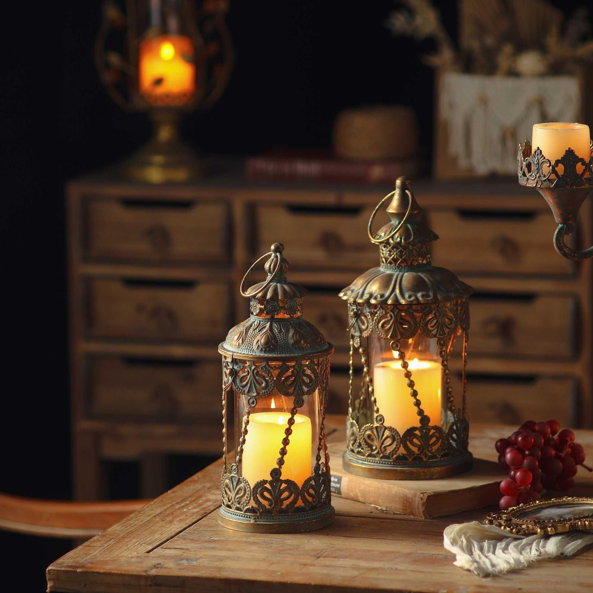 Mael lantern, the taller on the right, shown beside the smaller Mylan lantern, both lit. Sold separately.