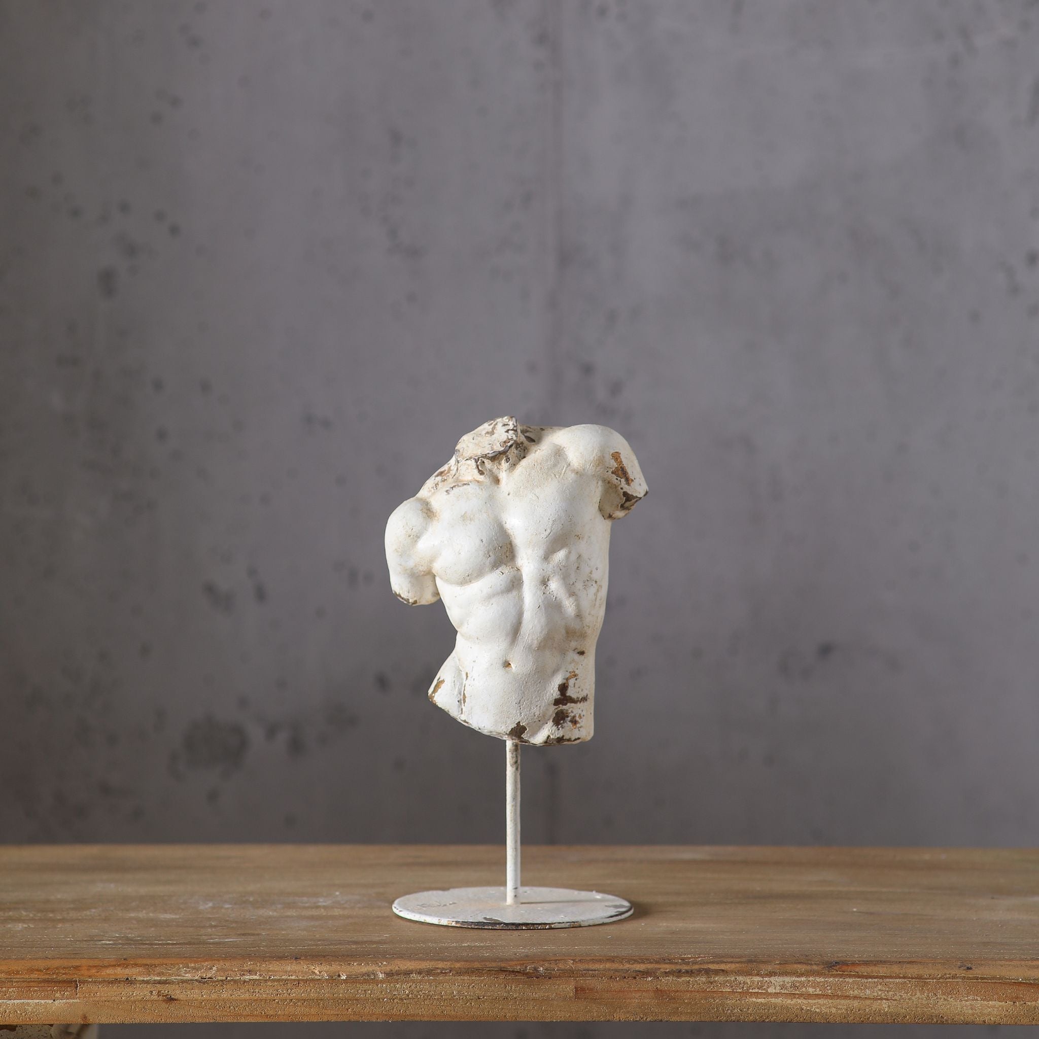 Adonis distressed white male torso sculpture on slim iron stand, classical Greek figure. Hero