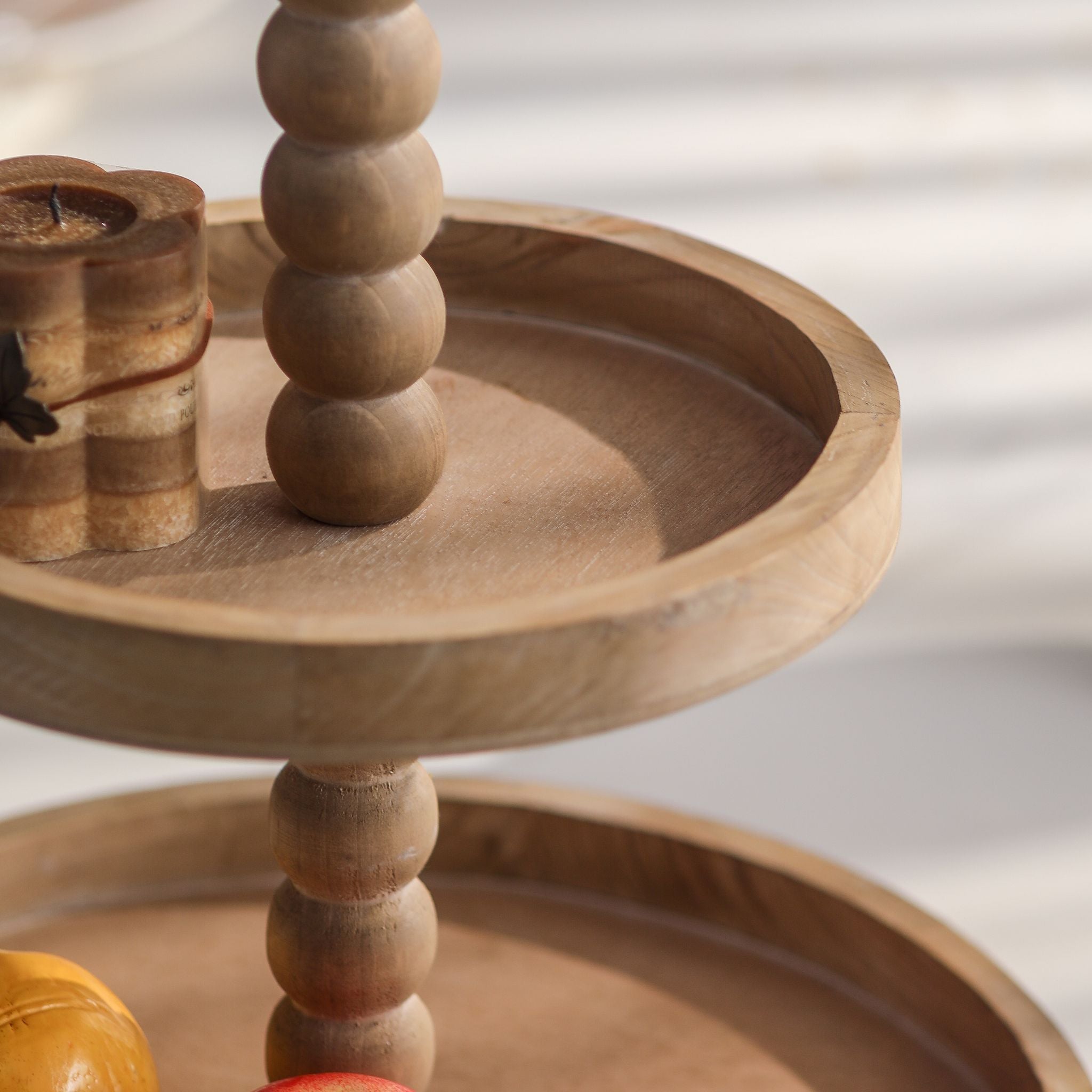 Mallory two tier tray stand showing the beaded wooden stem between the two trays.