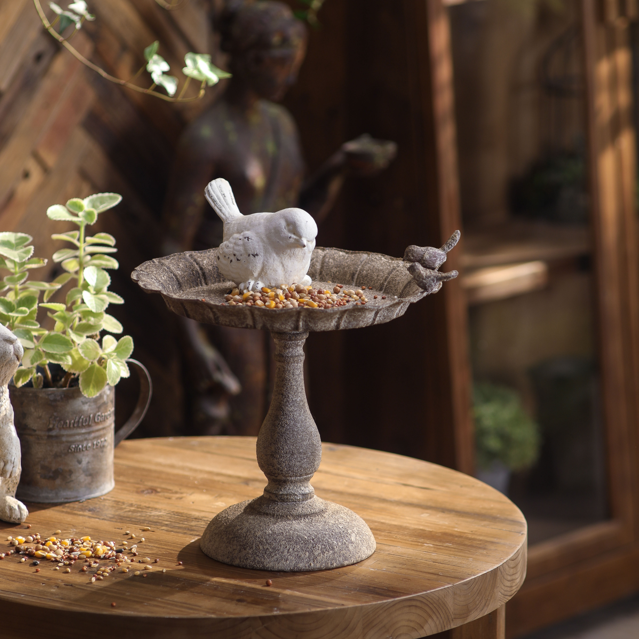 provincial-bird-feeder-main.jpgManon French Provincial pedestal bird feeder styled with mirror, statue and greenery
