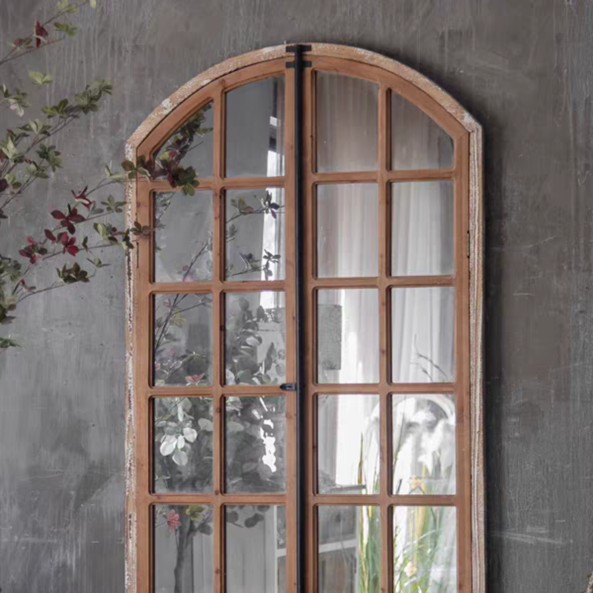 Top arch detail of the Mathieu French Provincial window mirror with distressed timber edge