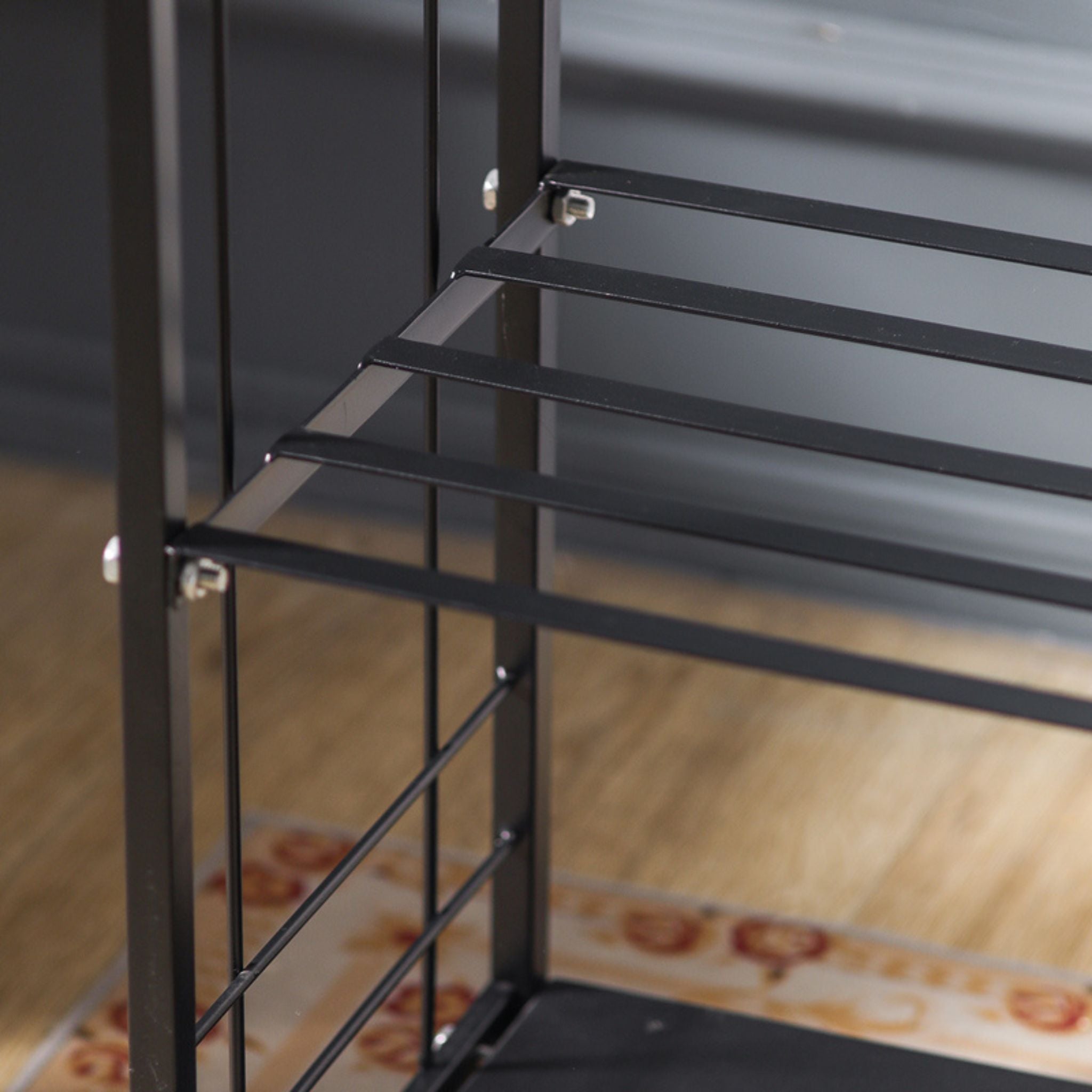 Close-up of the slatted shelf and bolt fixings on the Didier two-tier log rack.