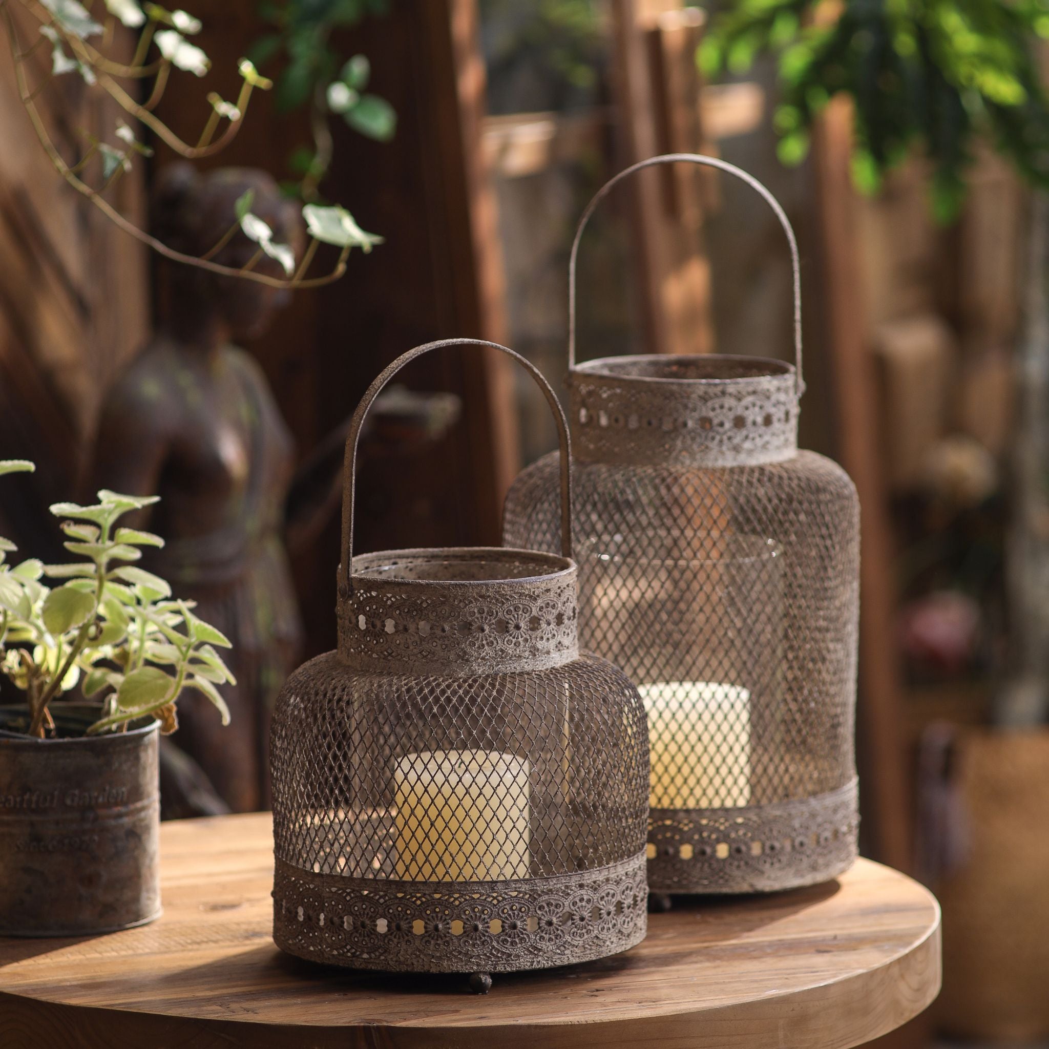 Two mesh candle lanterns in two sizes, taller companion sold separately