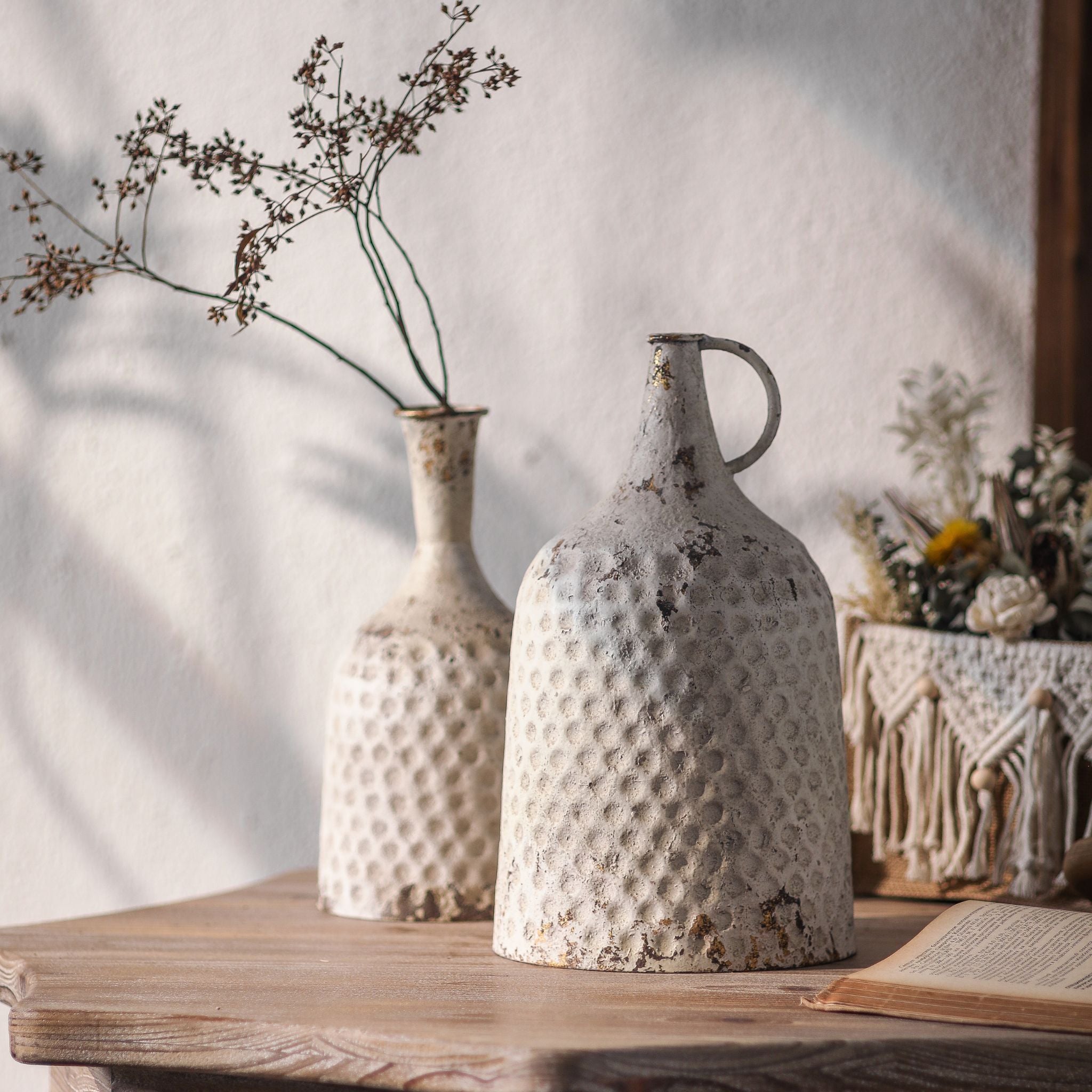 Michelle bottle vase shown on a table beside a separate handled jug, for scale and styling
