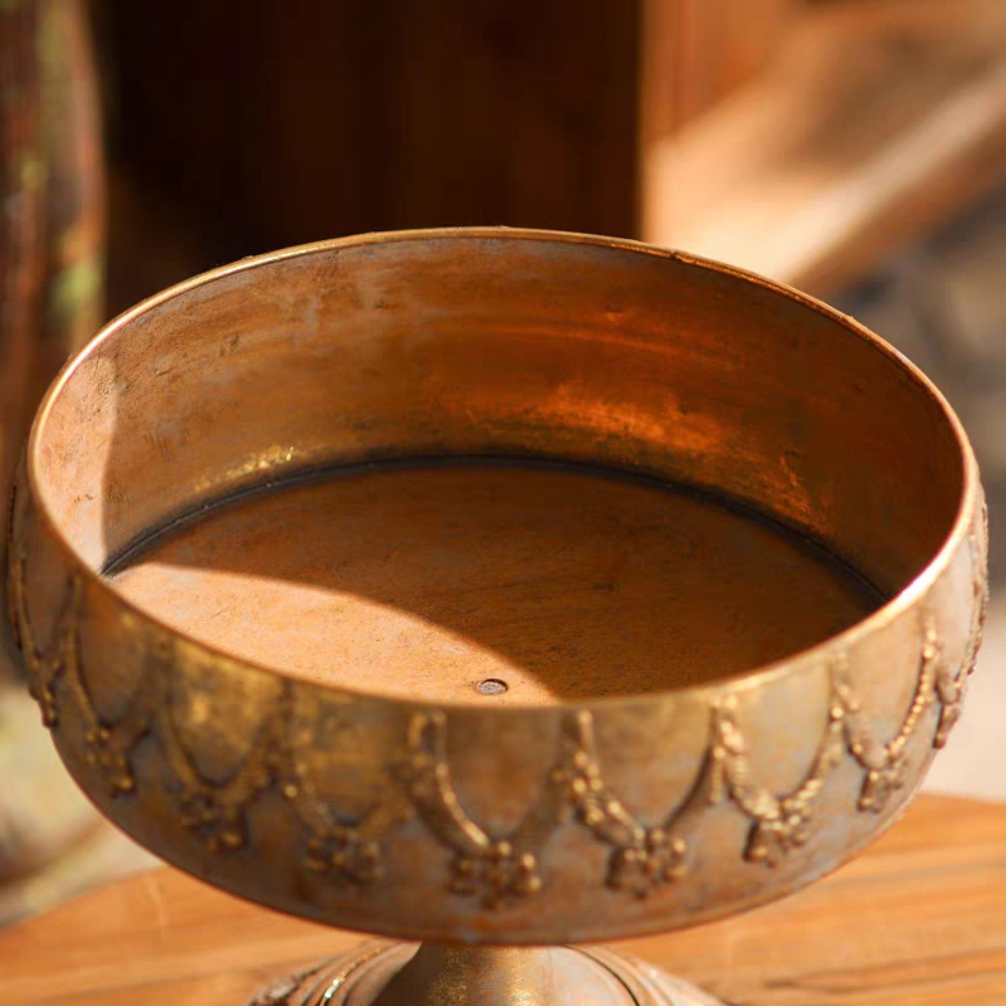 Top view into the Mirabelle antique gold metal compote bowl