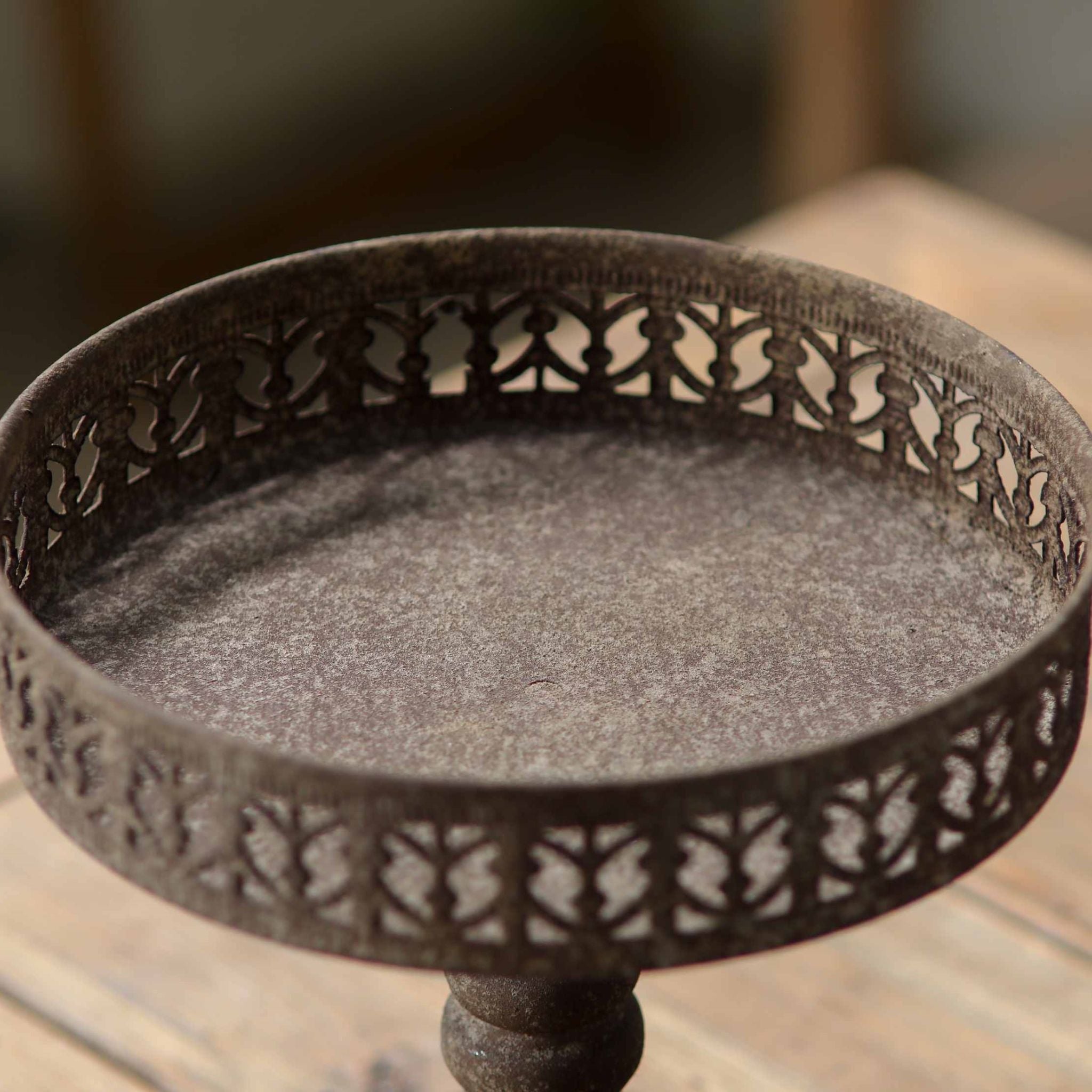 Mirielle pedestal stand overhead detail of the pierced openwork gallery rim and solid dish floor.