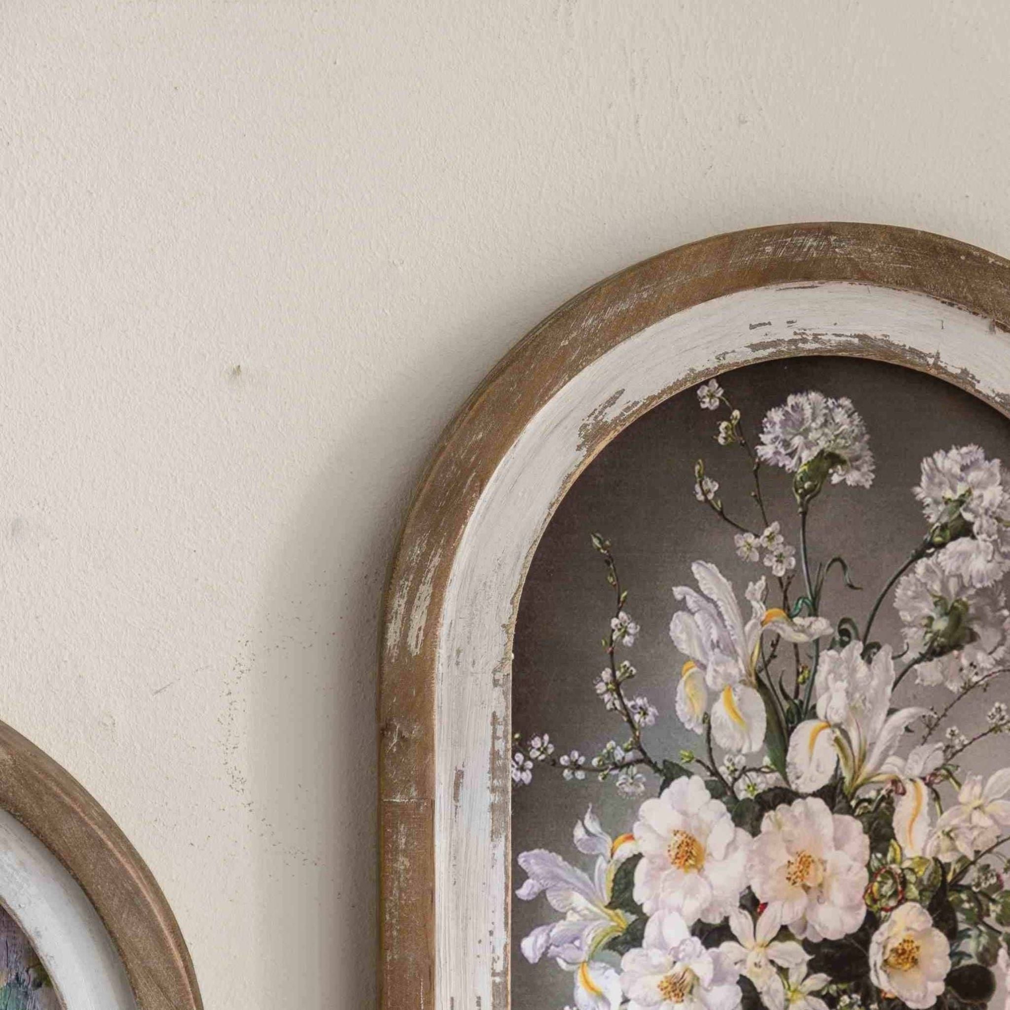 Close-up of the distressed white and wood frame on the Nadine arched wall art.