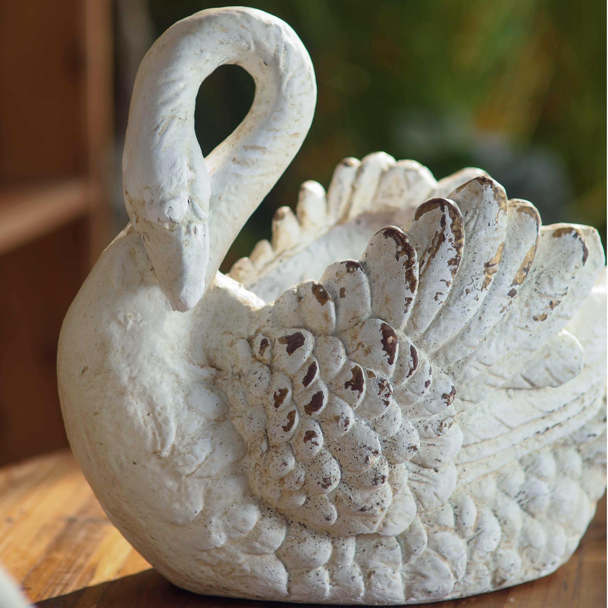 Odette swan planter close-up showing hand-finished feather detail, distressed whitewash finish and aged patina on the wings