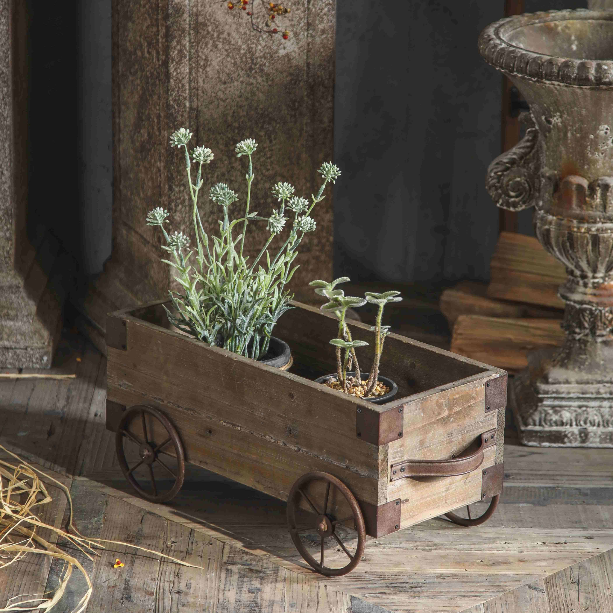 Pascal cart planter styled with potted succulents and dried flowers