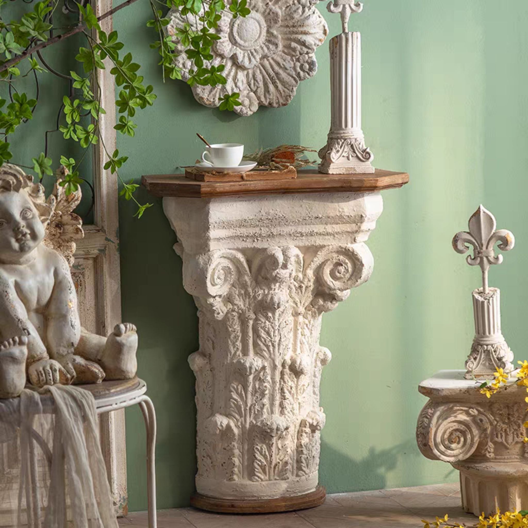 Pauline Corinthian capital console table in antique-white magnesia with a fir timber top. Hero.