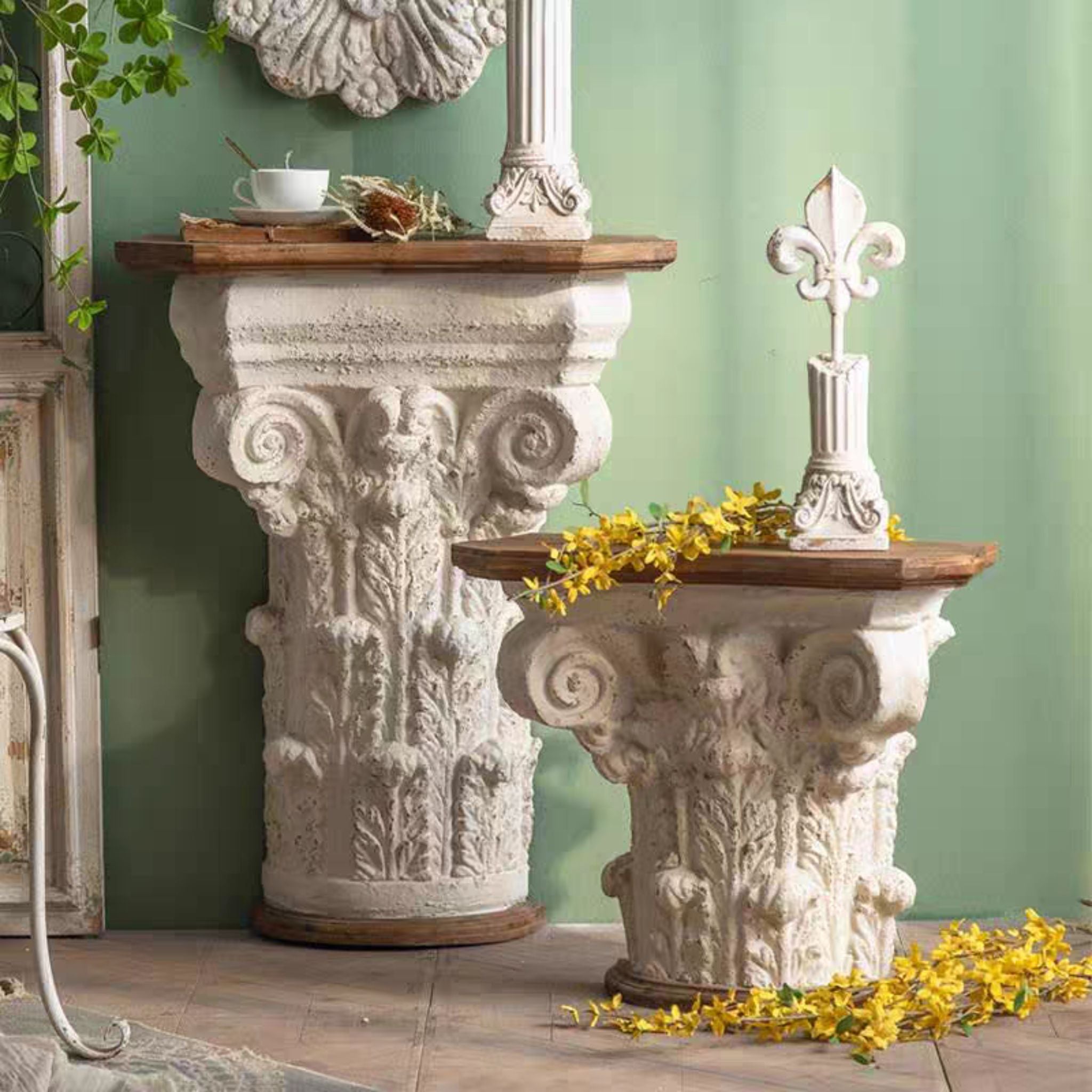 Pauline taller Corinthian capital console table beside the shorter matching Alice side table.
