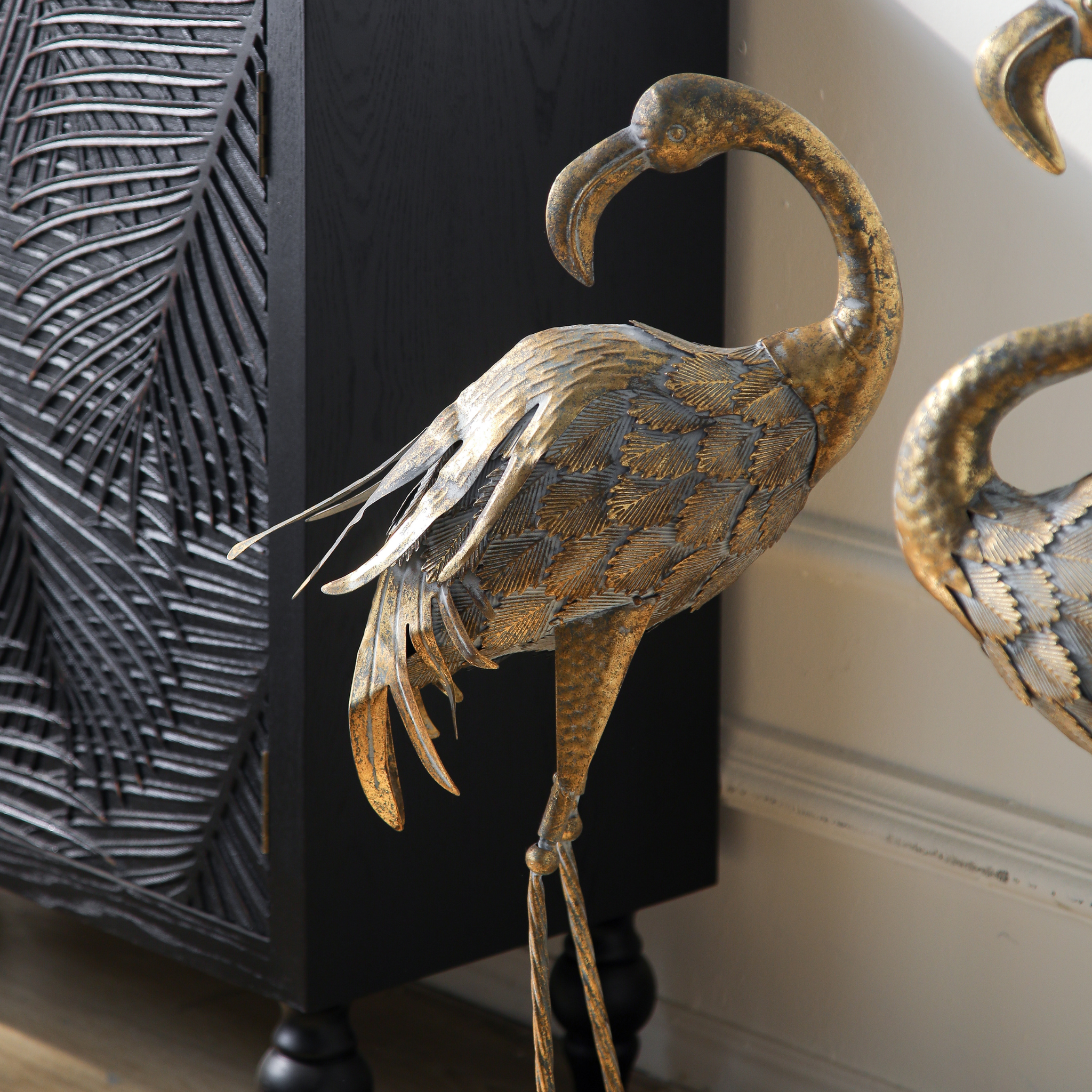 Detail of twisted iron legs and oval bases on Plumier flamingo sculptures