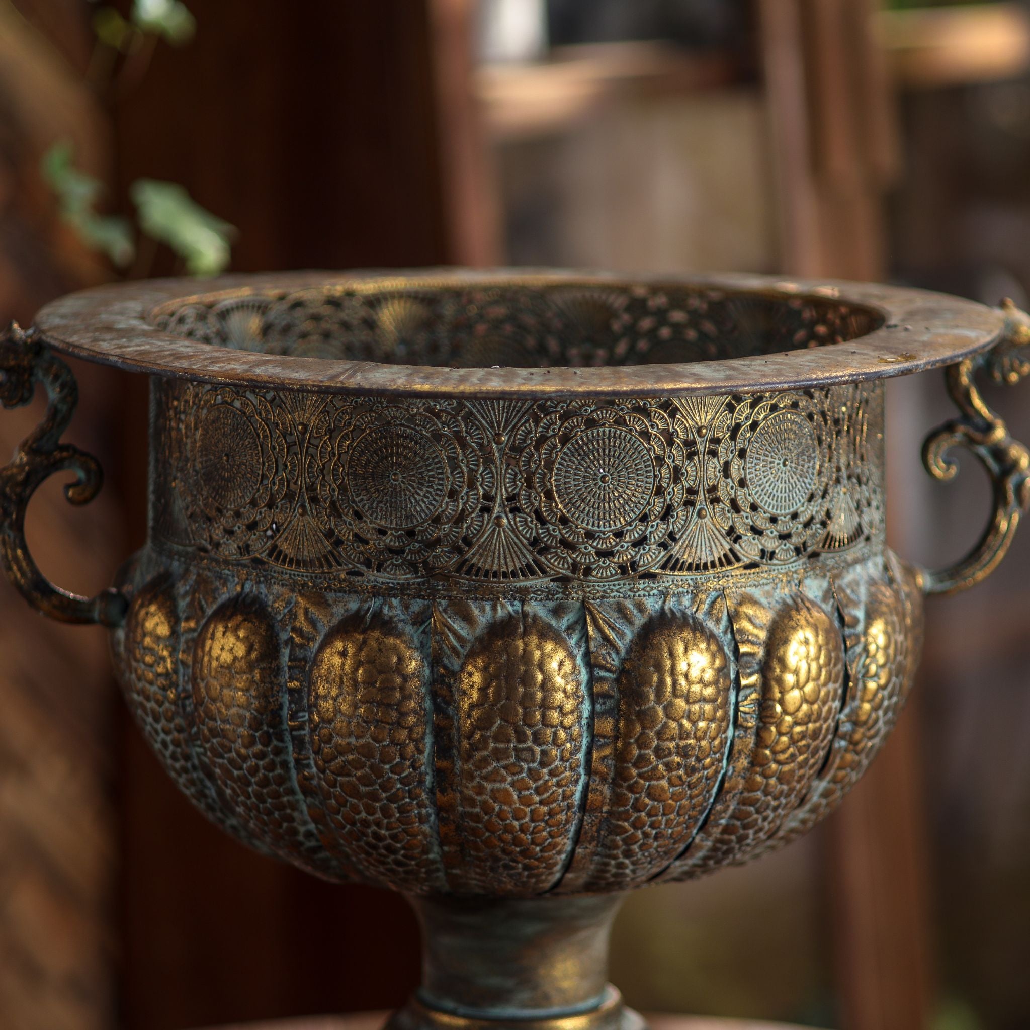 Regis urn planter close-up of the pierced filigree band and scroll handle