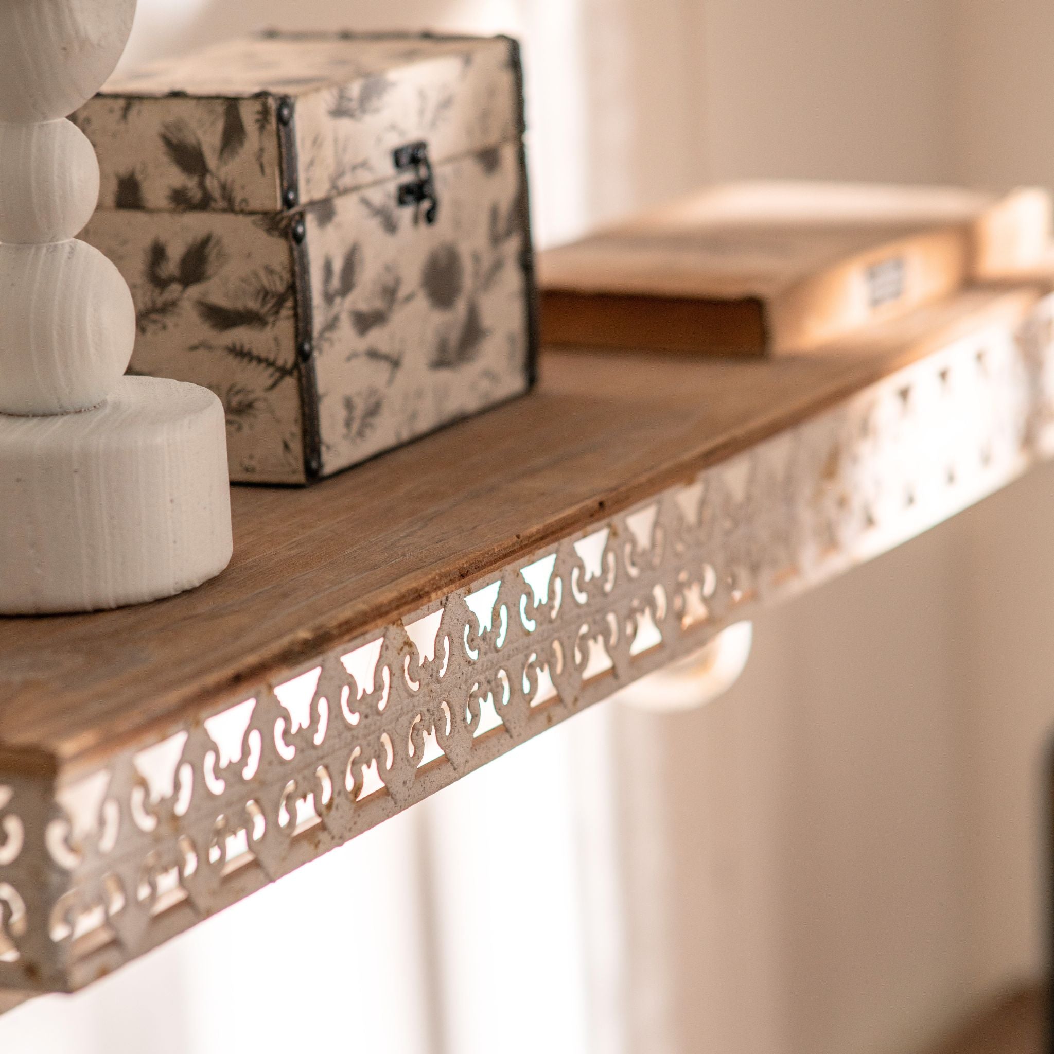 Simone wall shelf close-up of the pine top and pierced fretwork gallery