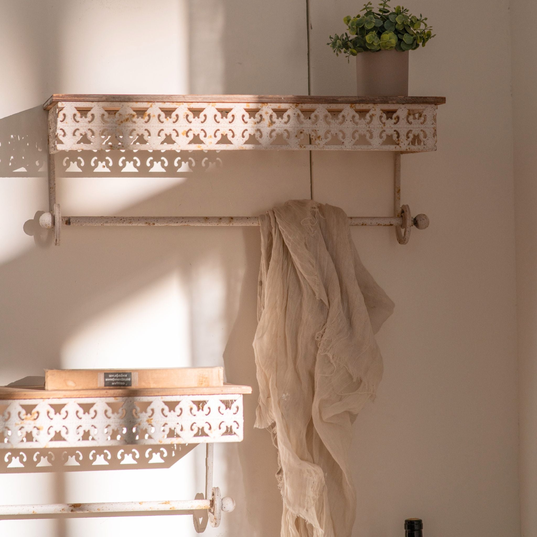 Simone wall shelves showing both sizes with linen draped over the lower rail