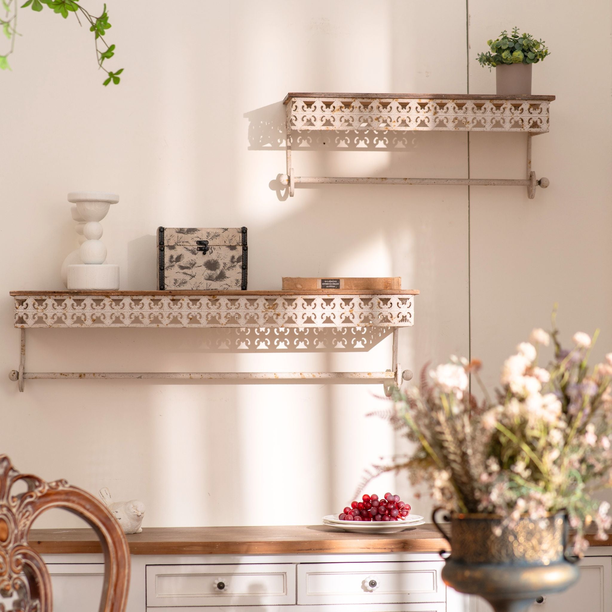 Simone set of two distressed metal wall shelves with pine tops and towel rails, styled on a wall. Hero.