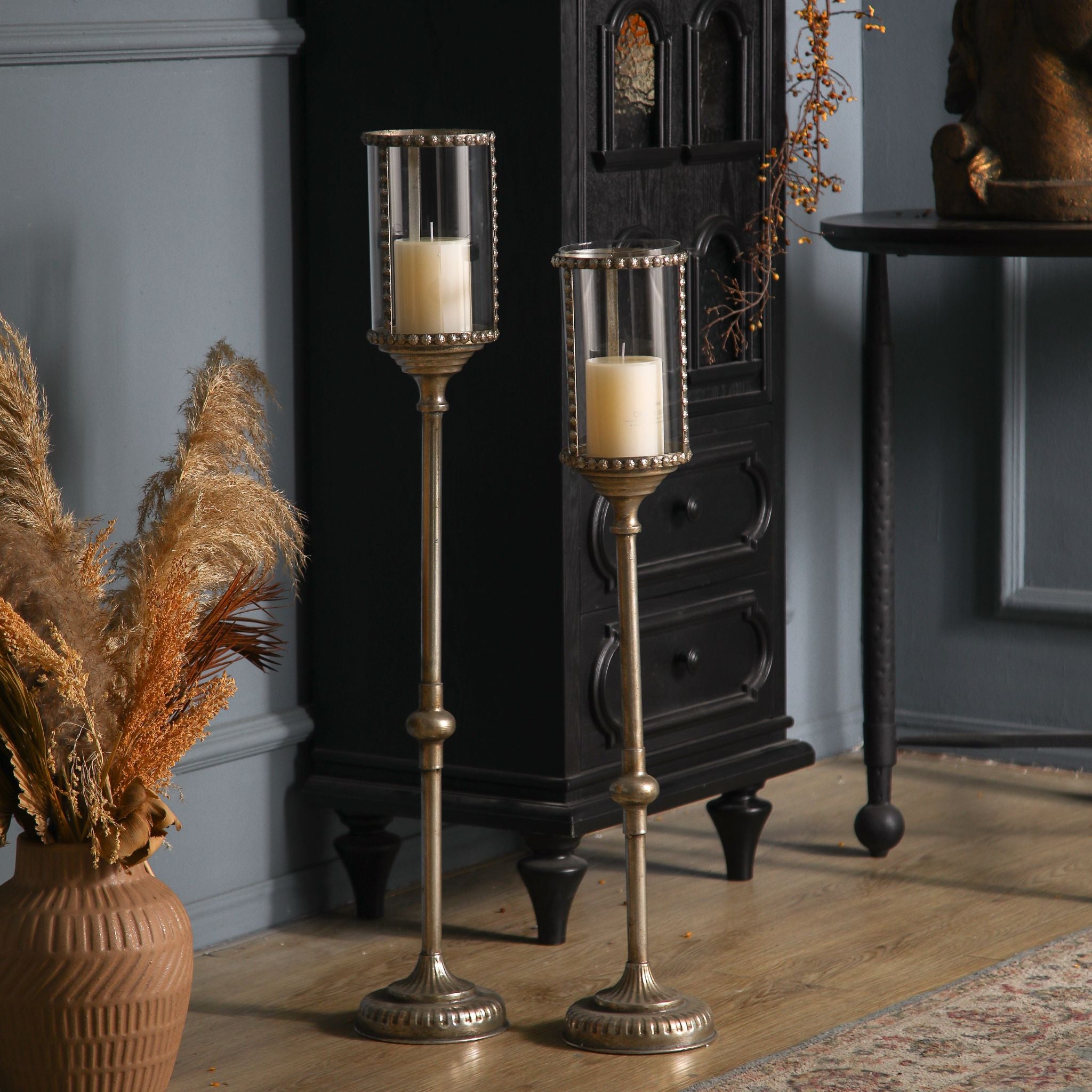 Sylvestre, the shorter floor candle holder, shown with the taller Yves. Each sold separately.