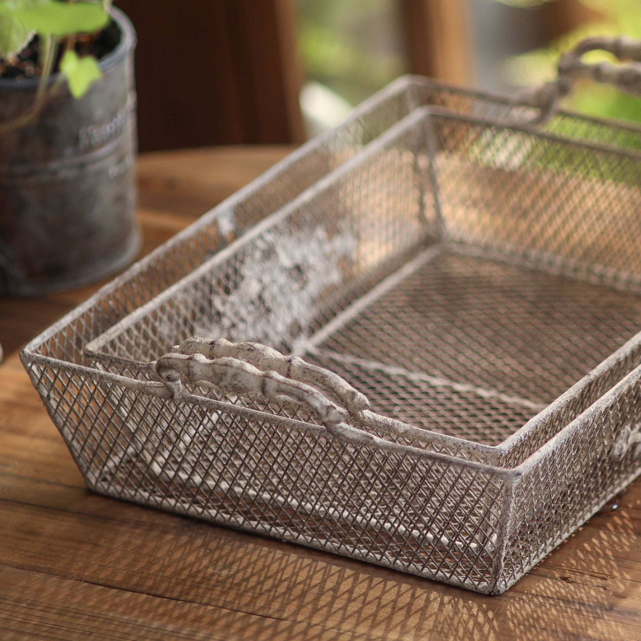 Close view of the handle detail and wire mesh on the Sylvie tray
