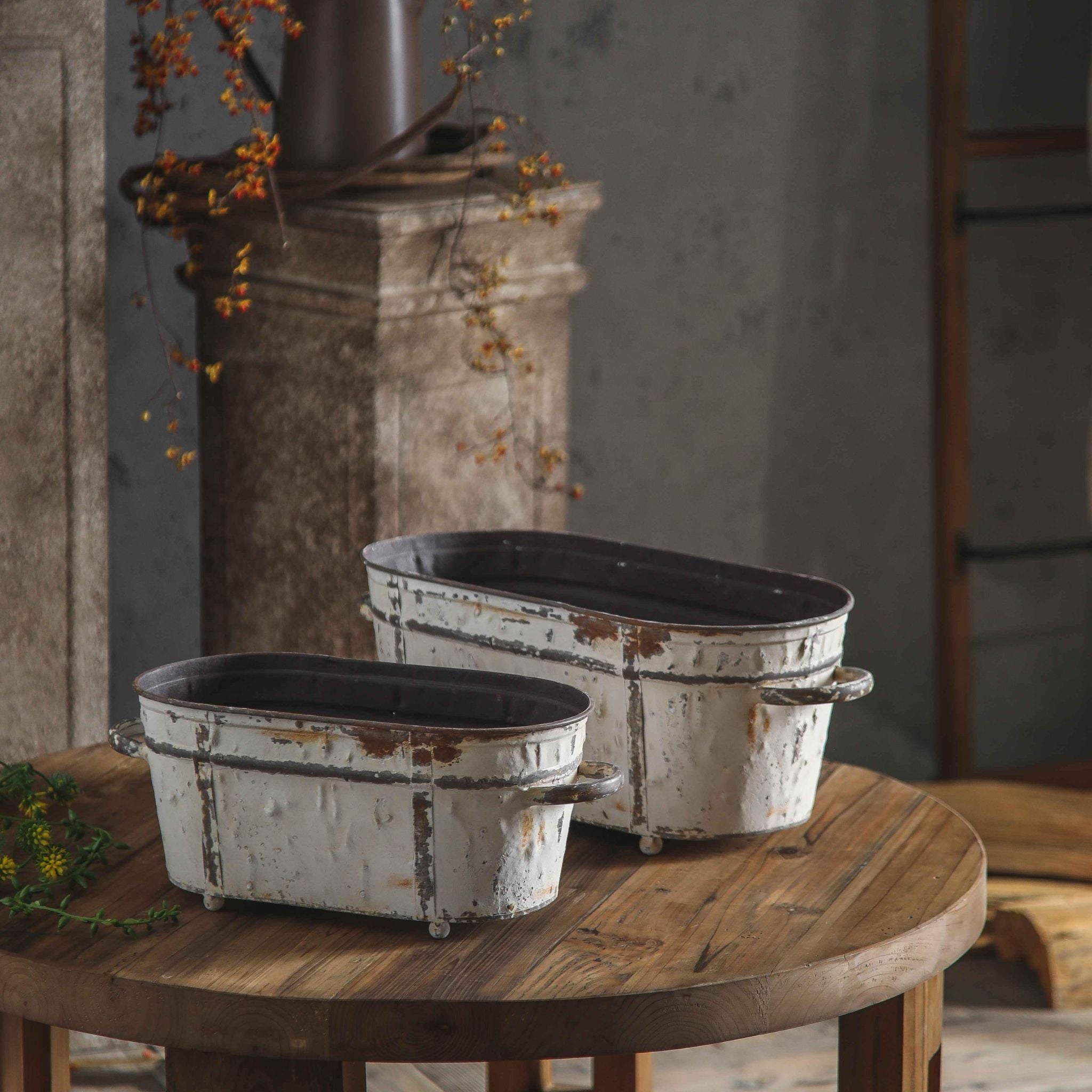 Lucie set of two aged metal trough planters in distressed white, with twin handles and ball feet