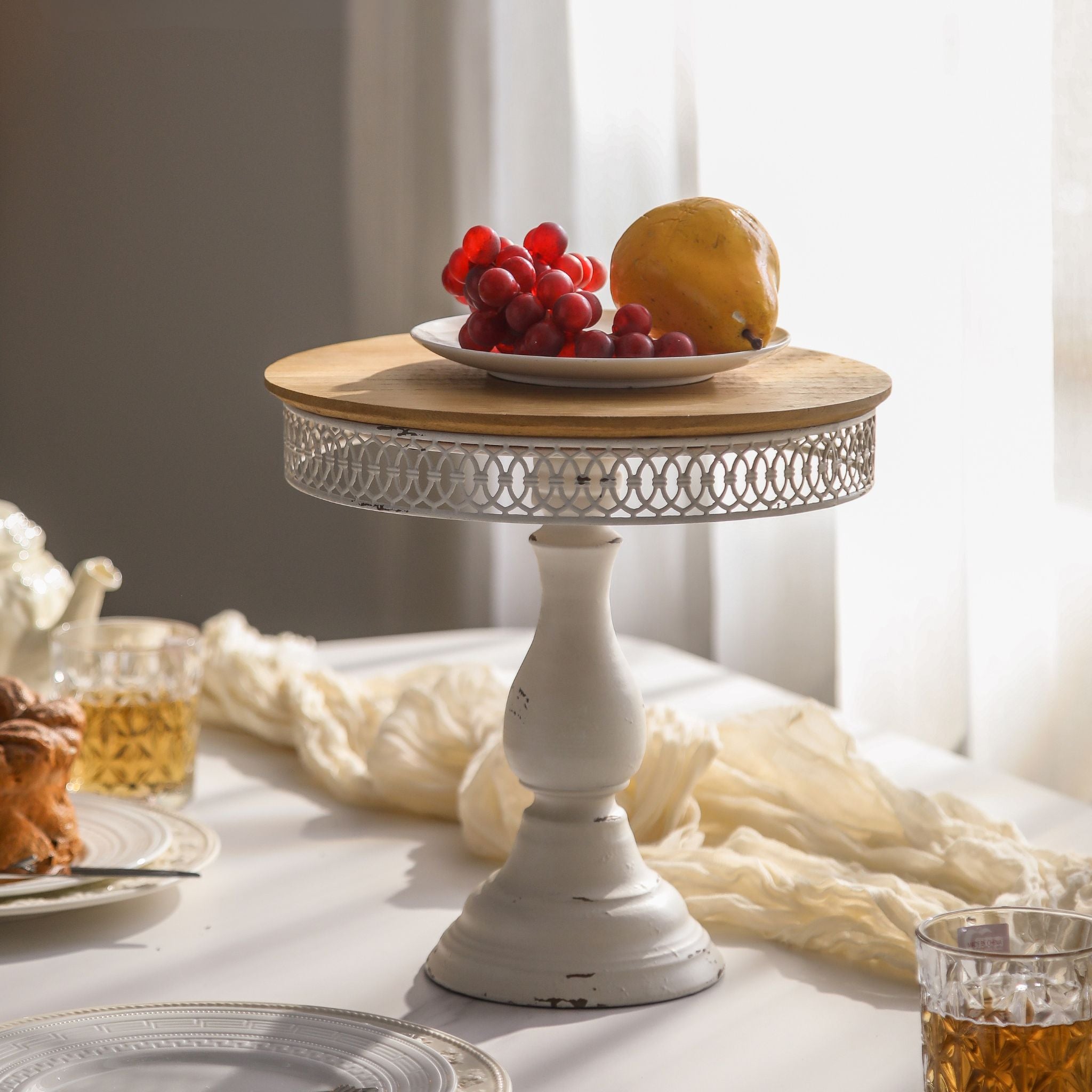 Violette French Provincial cake stand with a natural timber top and distressed white pedestal. Hero.