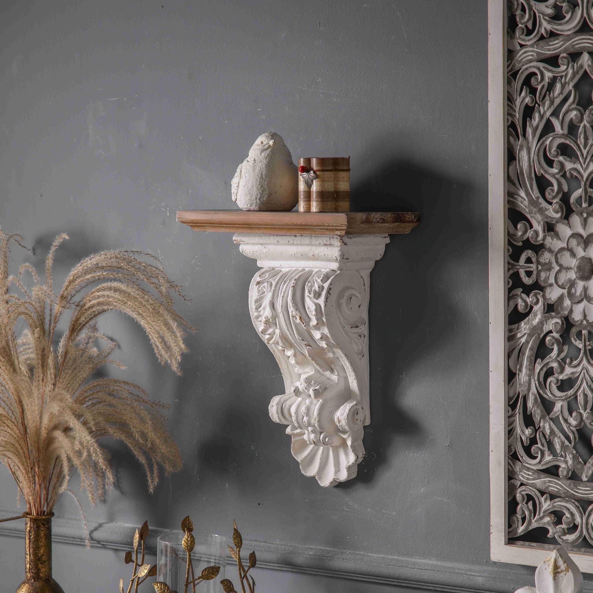 Viviane corbel wall shelf in a styled room scene with dried grasses
