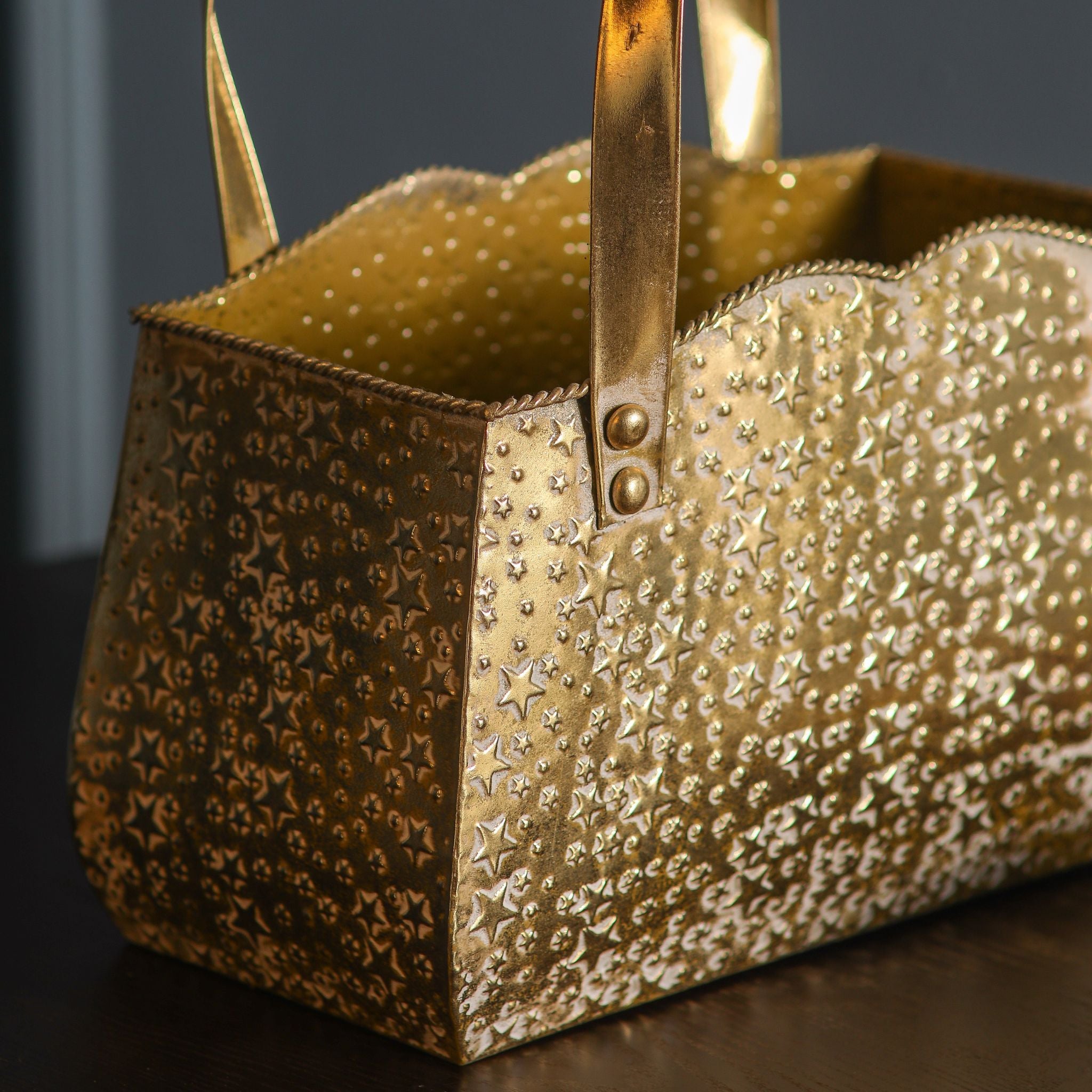 Open top of the gold handbag planter showing the embossed stars, scalloped rim and twisted rope trim